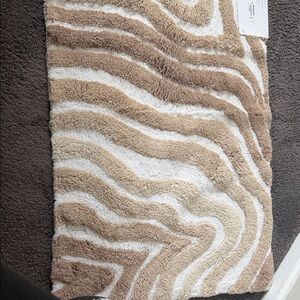 Hotel Collection Carved Marble Bath Rug in Beige and Cream. 2 rugs included